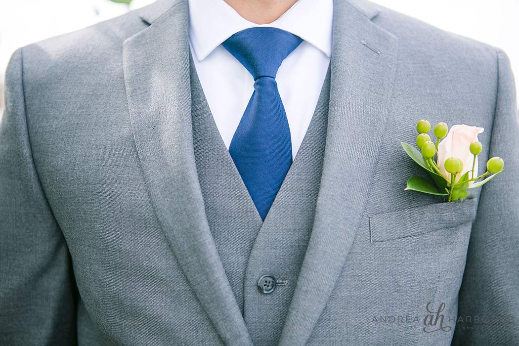 Groomsmen getting ready with yellow rose boutonniere Groomsmen getting ready with yellow rose boutonniere