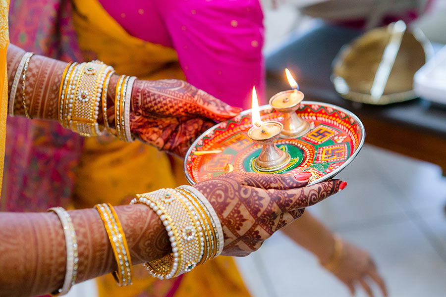 candle blessing during indian wedding ceremony