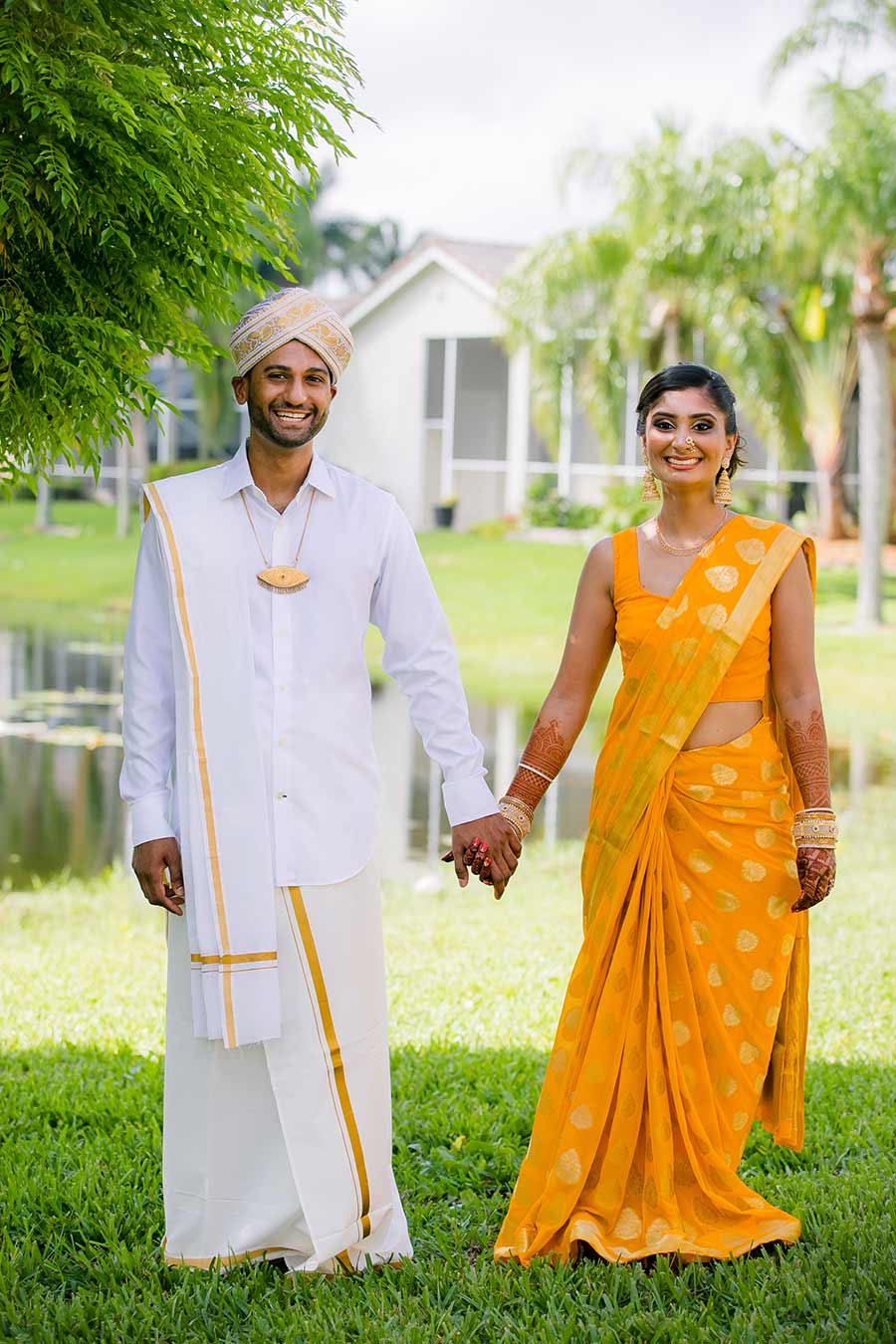 indian bride and groom in gold sari