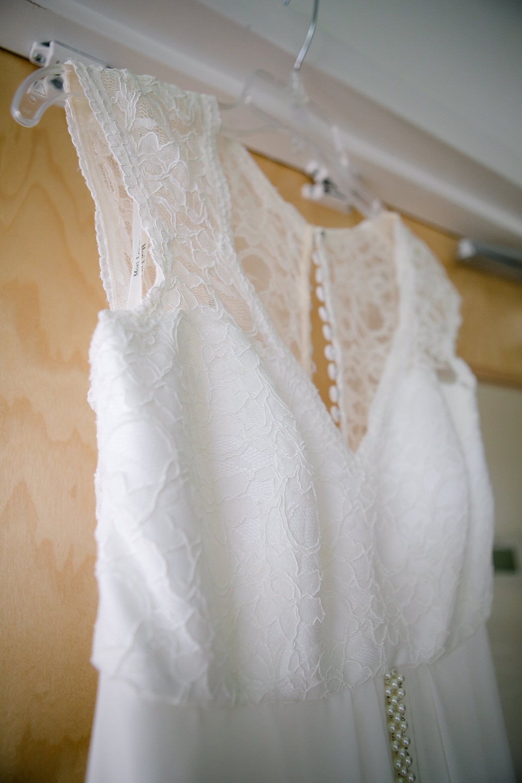 bridal dress hanging in hotel before ceremony bridal dress hanging in hotel before ceremony