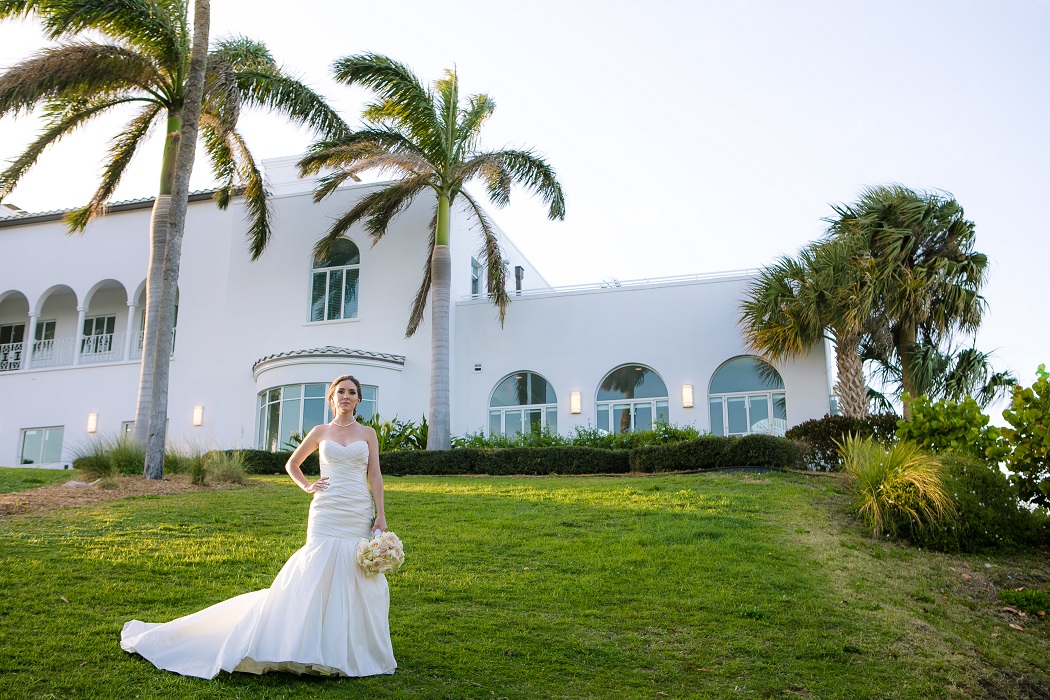 bride poses for wedding photographer