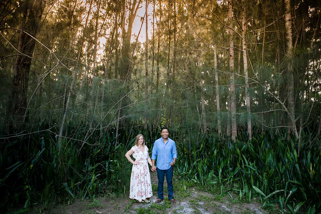 engagement photoshoot surrounded by fir trees in plantation heritage park