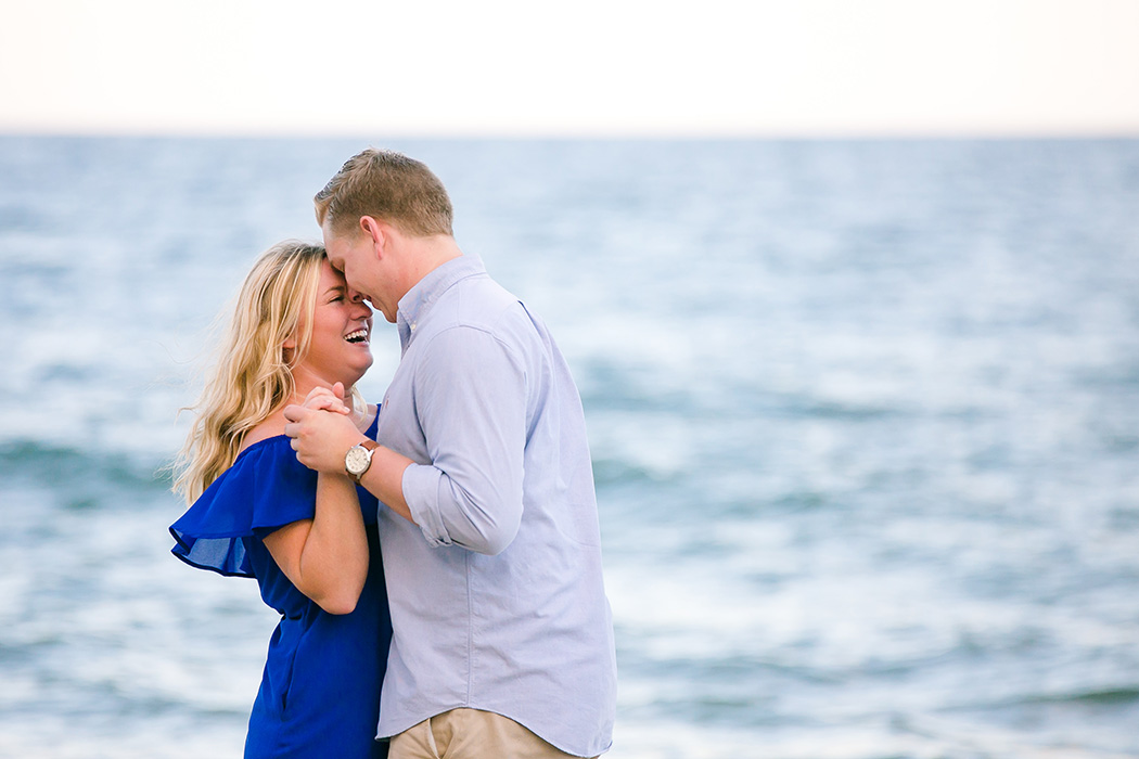 unique posing idea for recently engaged couple