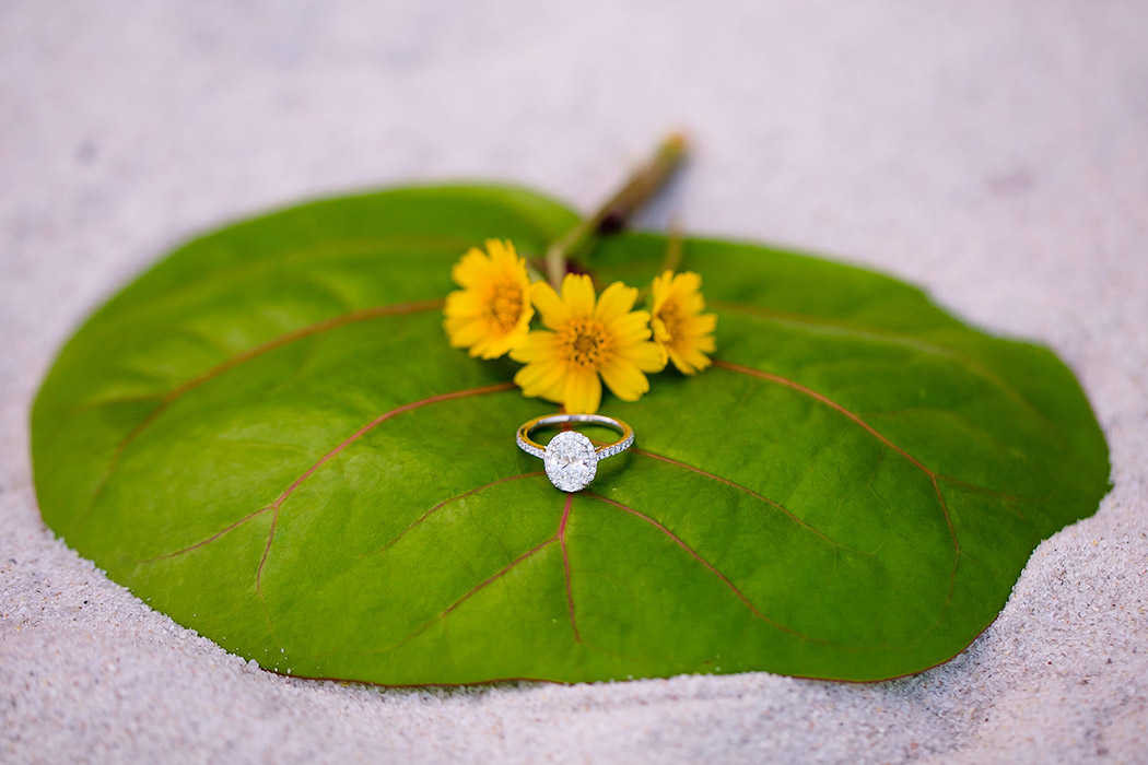 unique way to photography diamond engagement ring on the beach