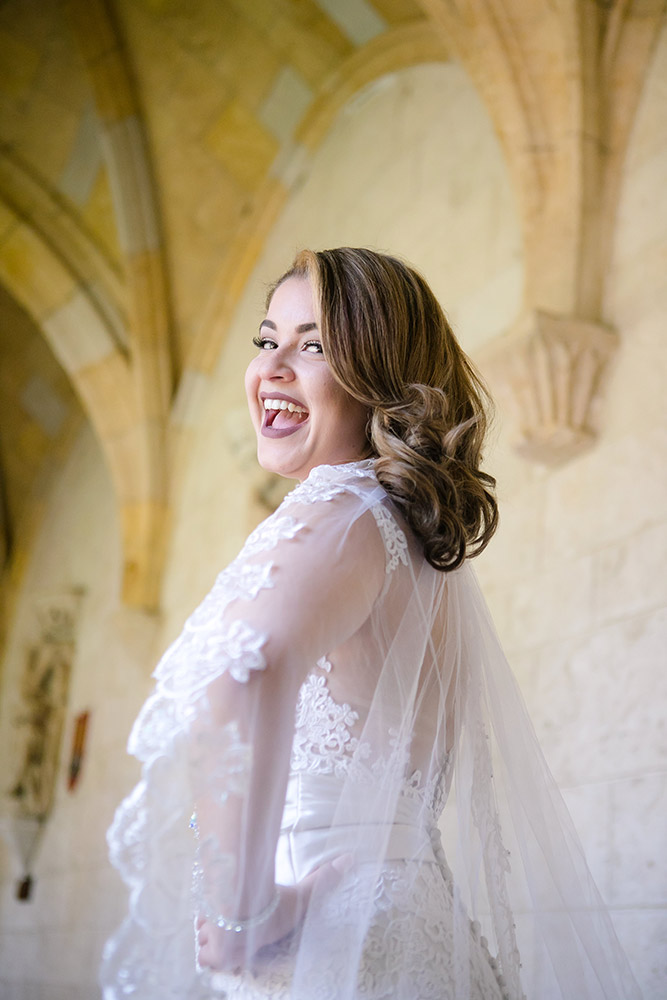fun bridal portraits before the wedding ceremony. bride wears beautiful antique lace wedding dress