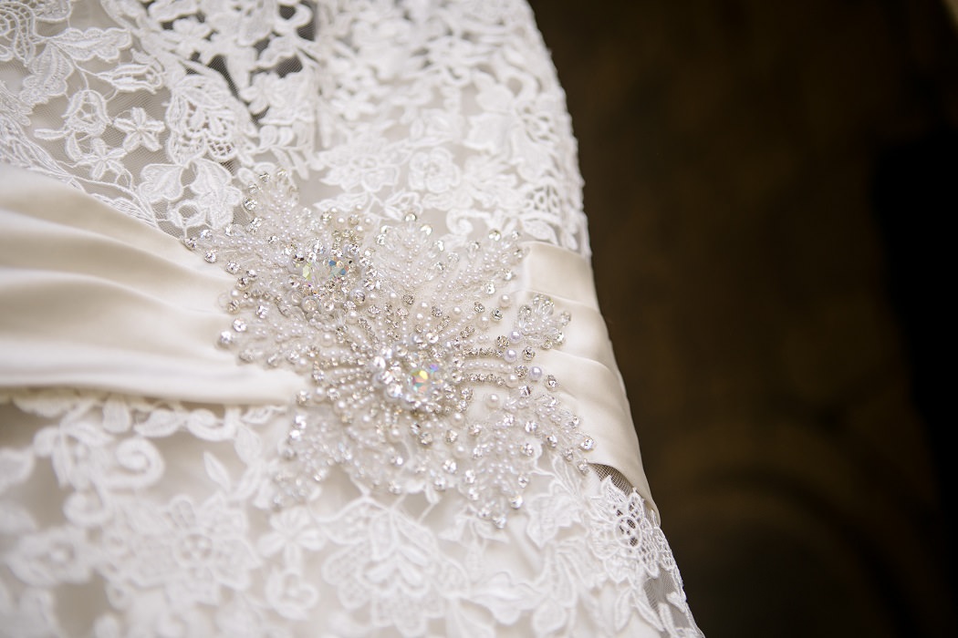 detail shot of lace and crystals on wedding dress | andrea harborne photography