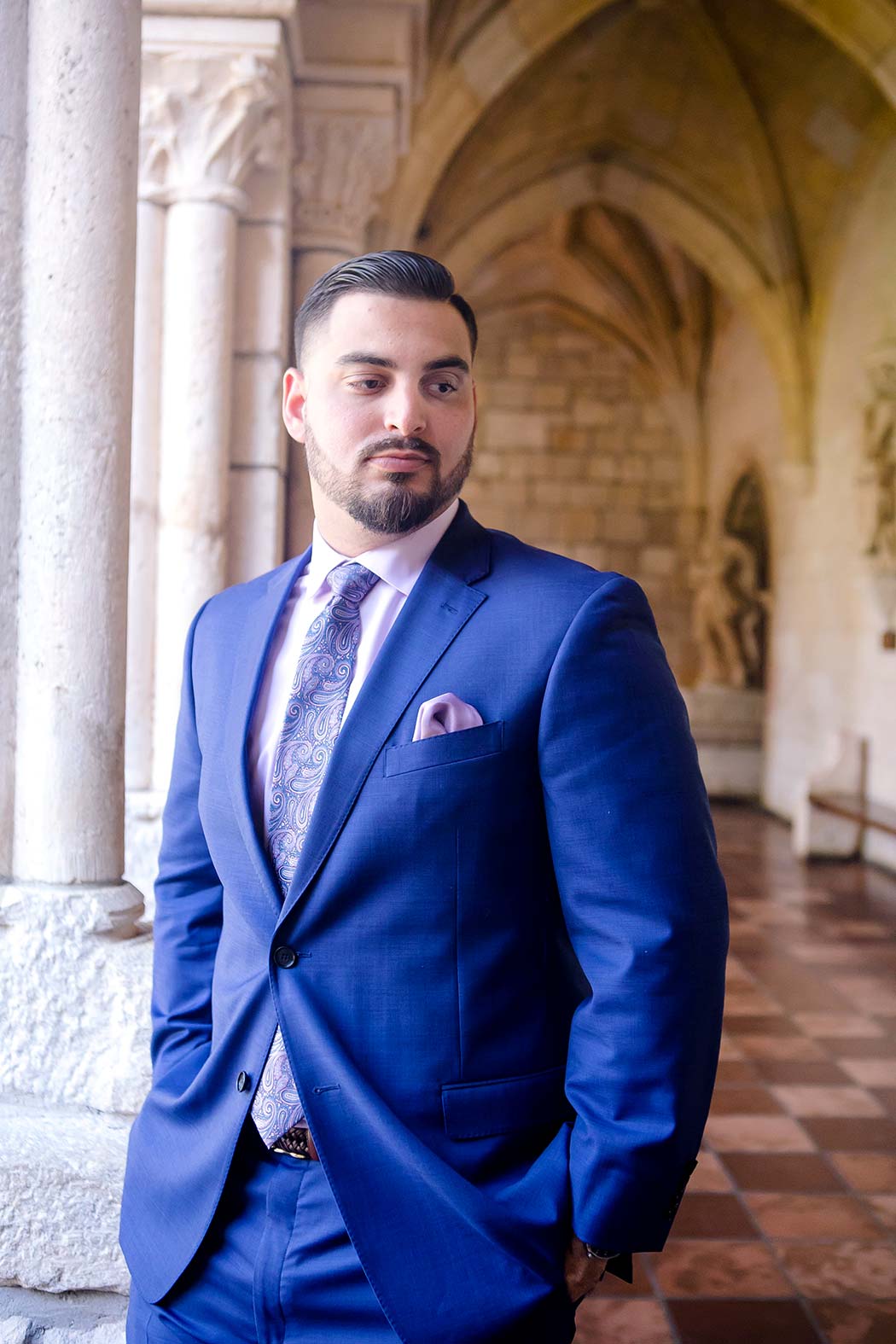 groom poses during wedding photoshoot | ancient spanish monastery | andrea harborne photography