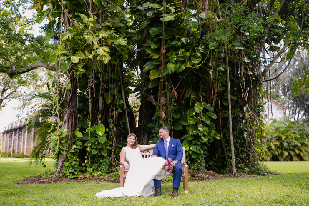 bride and groom seated pose | ancient spanish monastery | miami wedding photographer