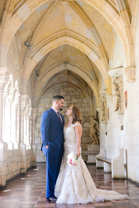 beautiful bride and groom celebrate in the ancient spanish monastery