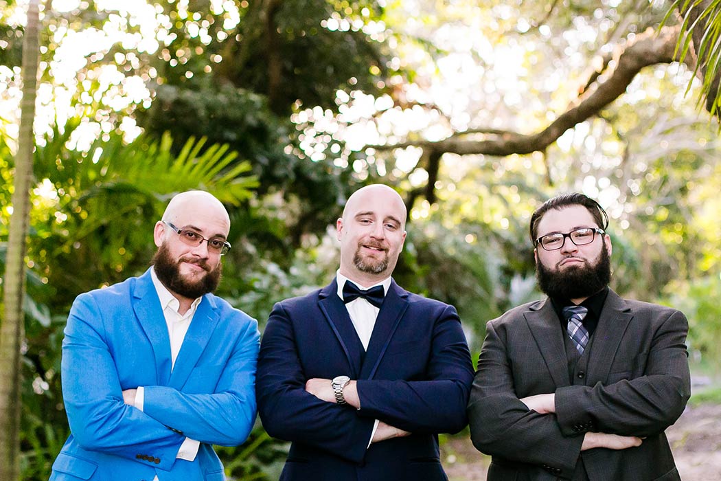 groom and his groomsmen in fun pose | modern wedding at living sculpture sanctuary davie