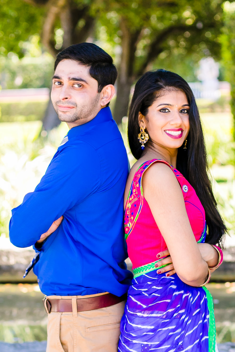 indian engagement photoshoot at vizcaya | couple stand back to back in traditional indian clothing
