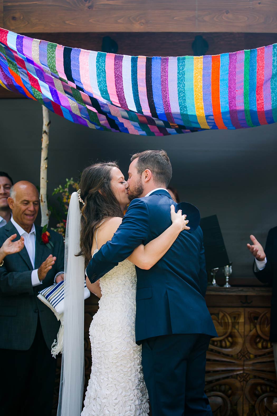 jewish bride and groom kiss under the chuppah at modern wedding, east hotel miami