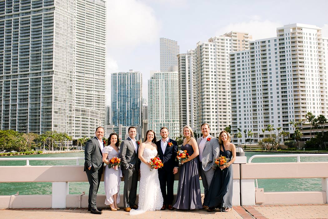 amazing photograph of bridal party posing against miami skyline