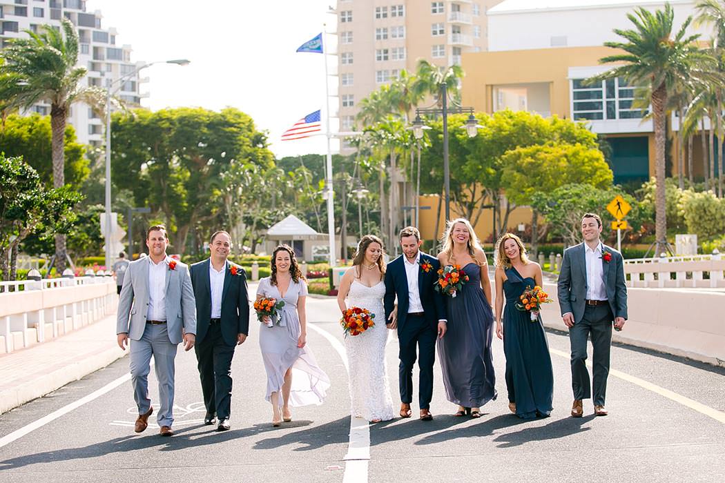 unique bridal party photo walking down brickell avenue in downtown miami