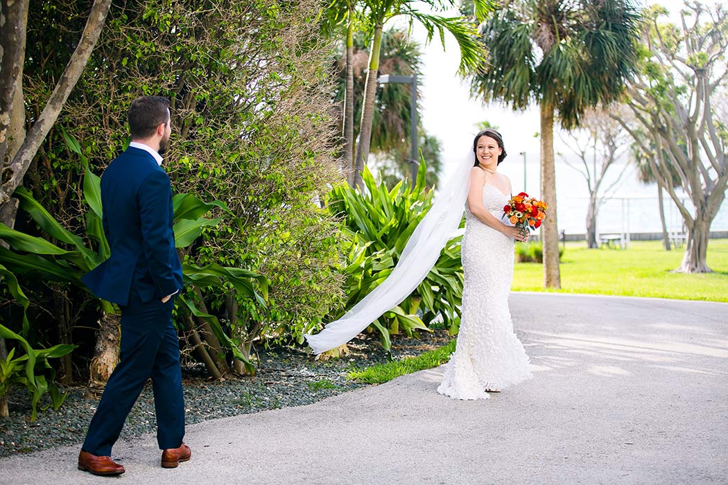 bride and groom first look in a miami park