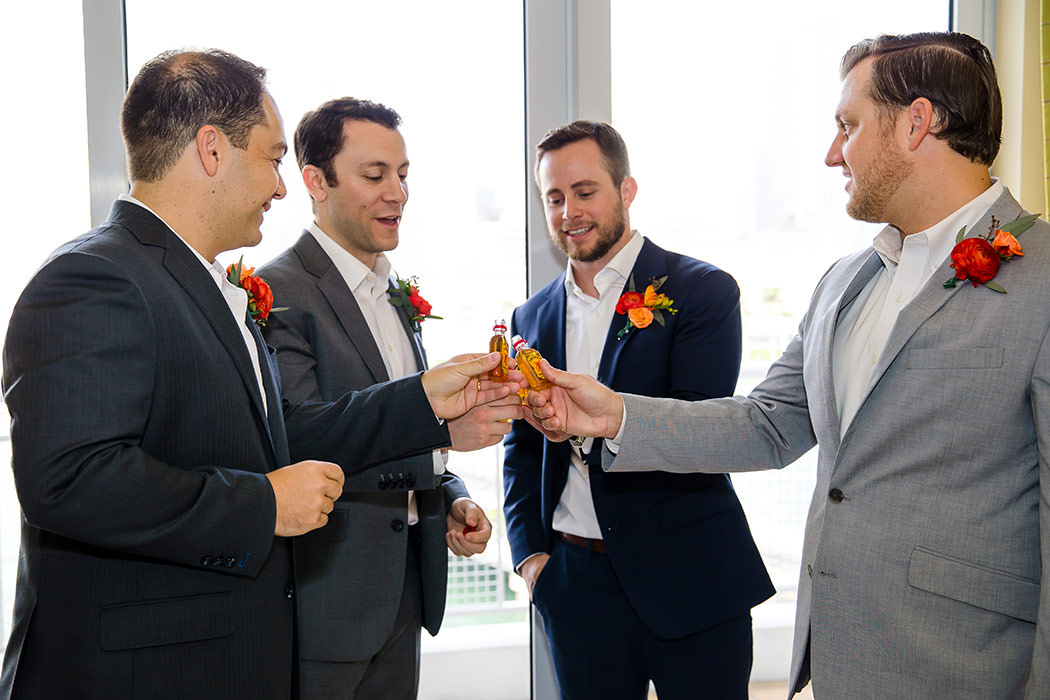 groomsmen toasting before modern jewish wedding at east miami