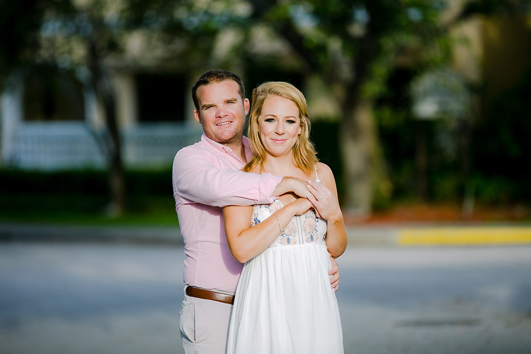 couple posing for engagement photoshoot on fort lauderdale's Las Olas Bouleard