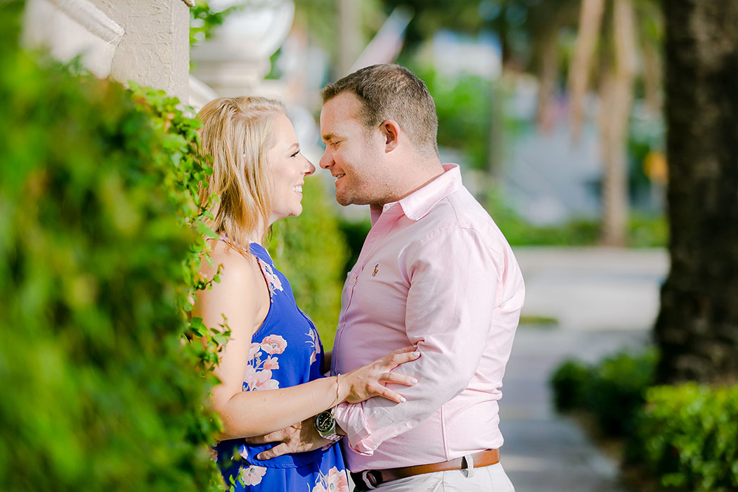 couple pose for romantic engagement photoshoot on las olas boulevard