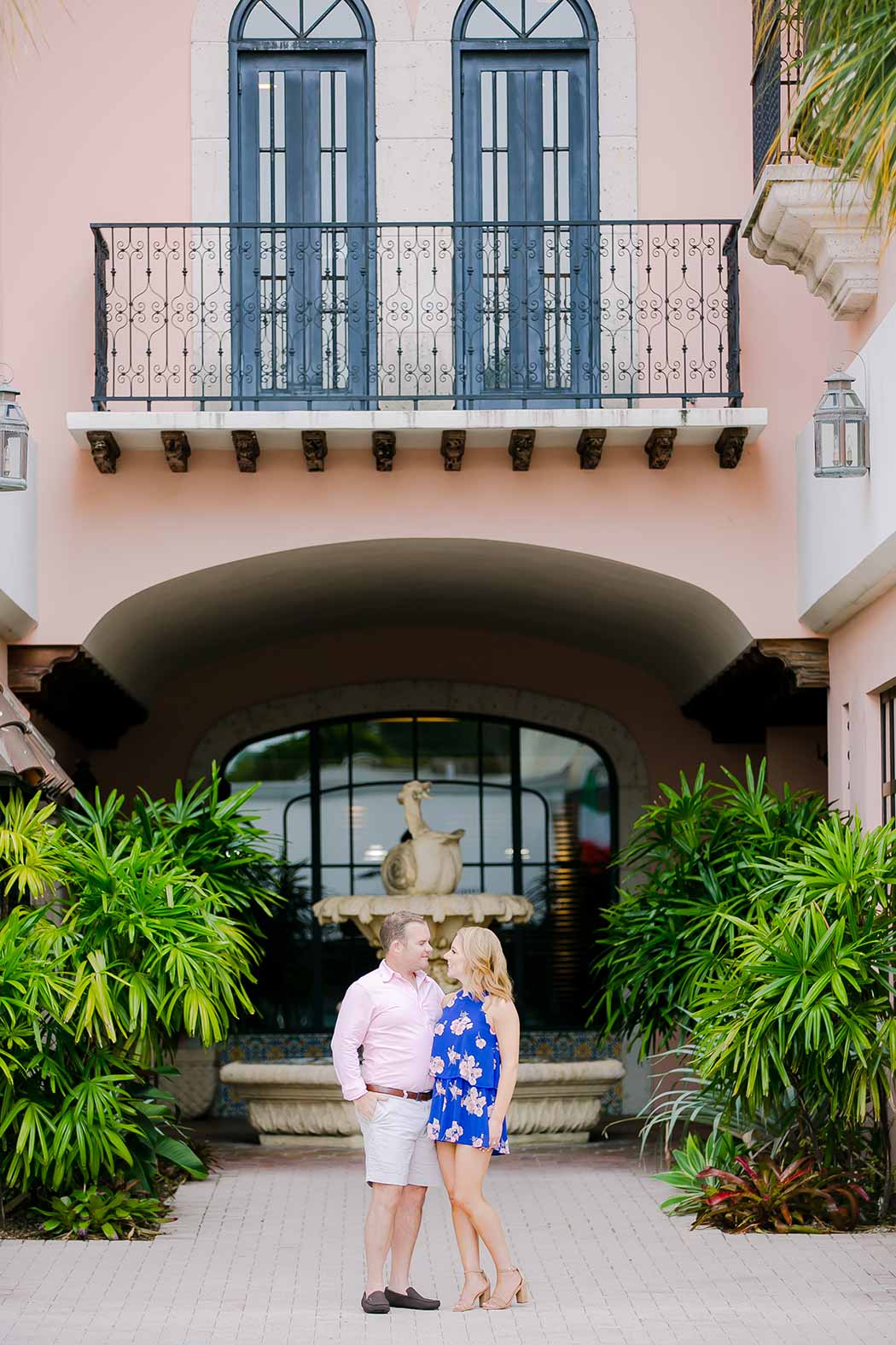 couple posing on las olas boulevard for an engagement session