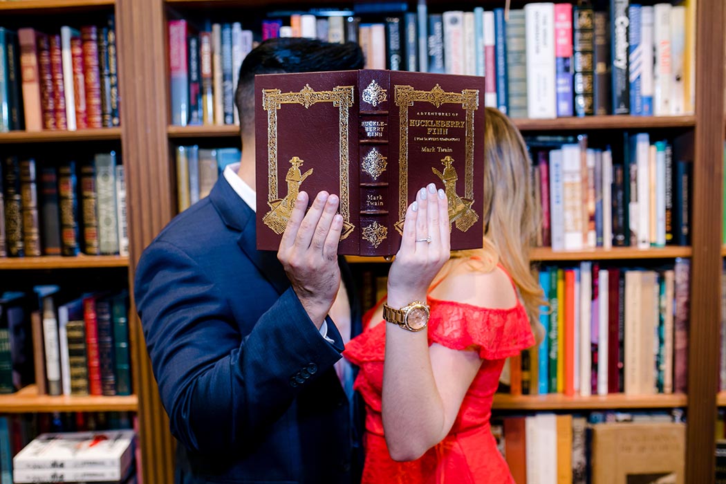 cute posing idea for couples book store engagement session | fort lauderdale wedding photographer