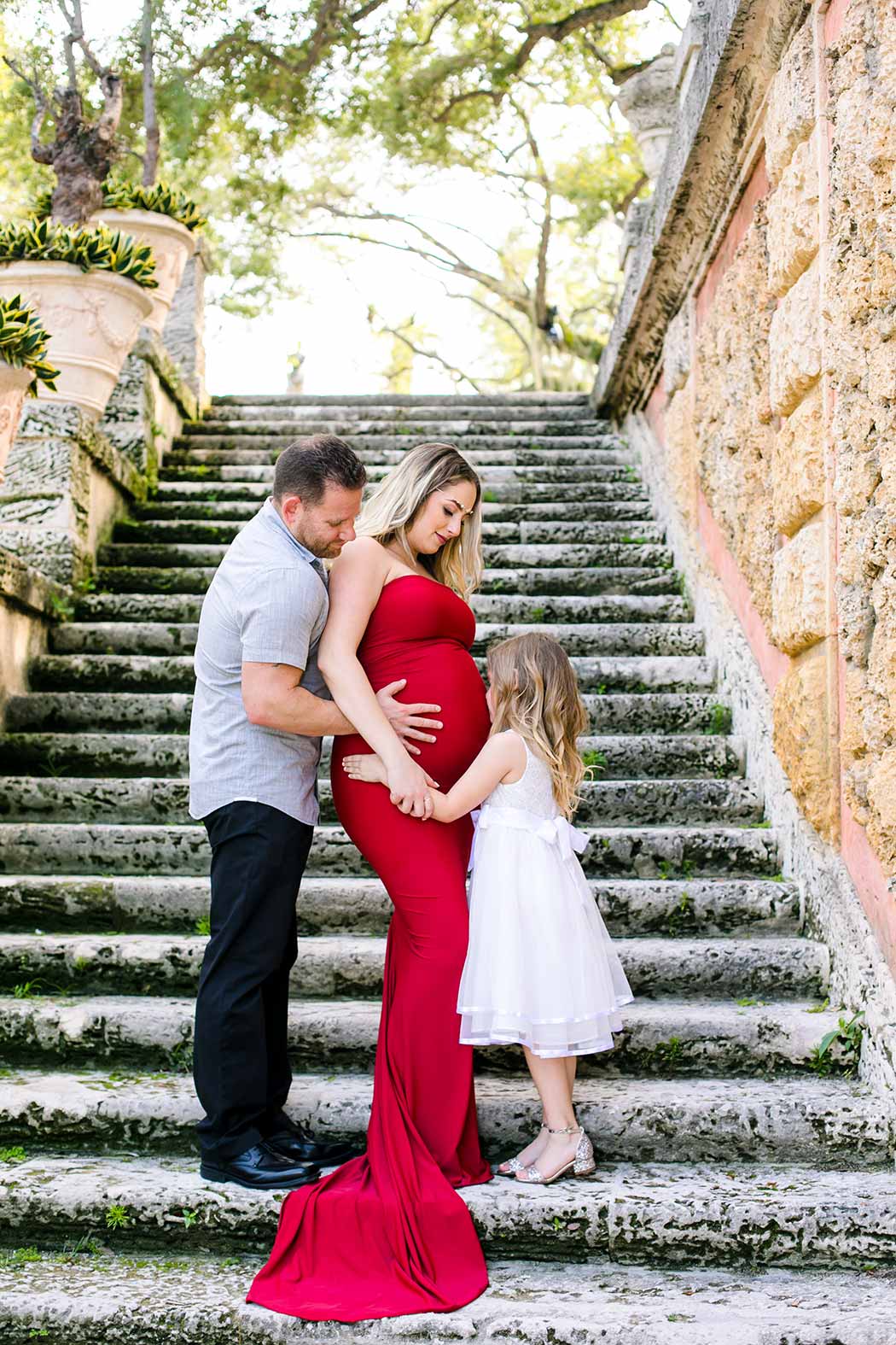 family of three maternity photoshoot on steps at vizcaya museum miami | maternity photographer fort lauderdale