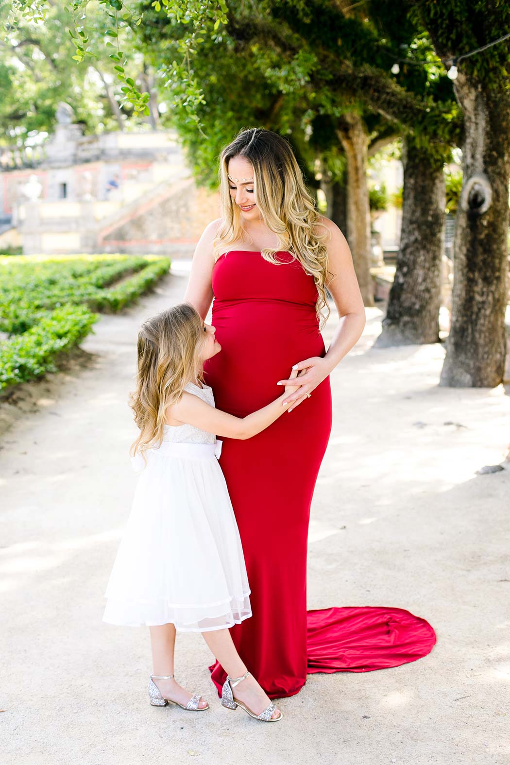 mother and daughter maternity session at miami's vizcaya museum elegant mother and daughter maternity session at vizcaya miami | red maternity dress