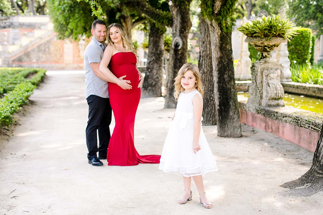 family enjoy an elegant maternity photoshoot at vizcaya museum and gardens miami