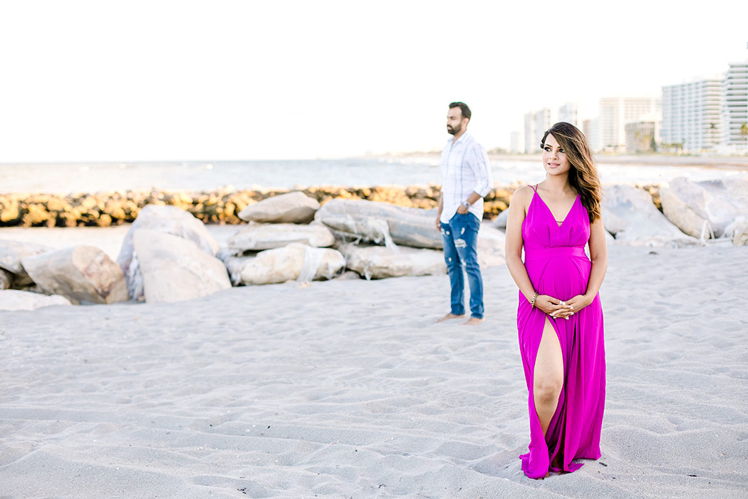 unique posing idea for beach maternity session with couple | sunset beach maternity photoshoot