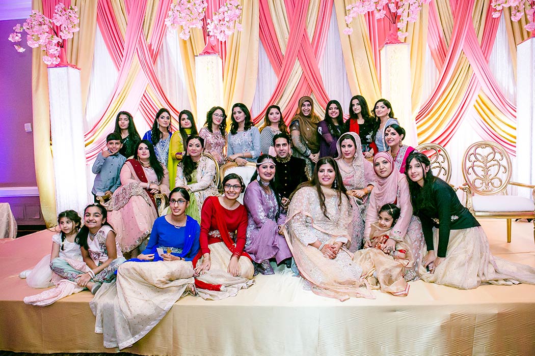 family pose during portraits at indian wedding bonaventure resort and spa