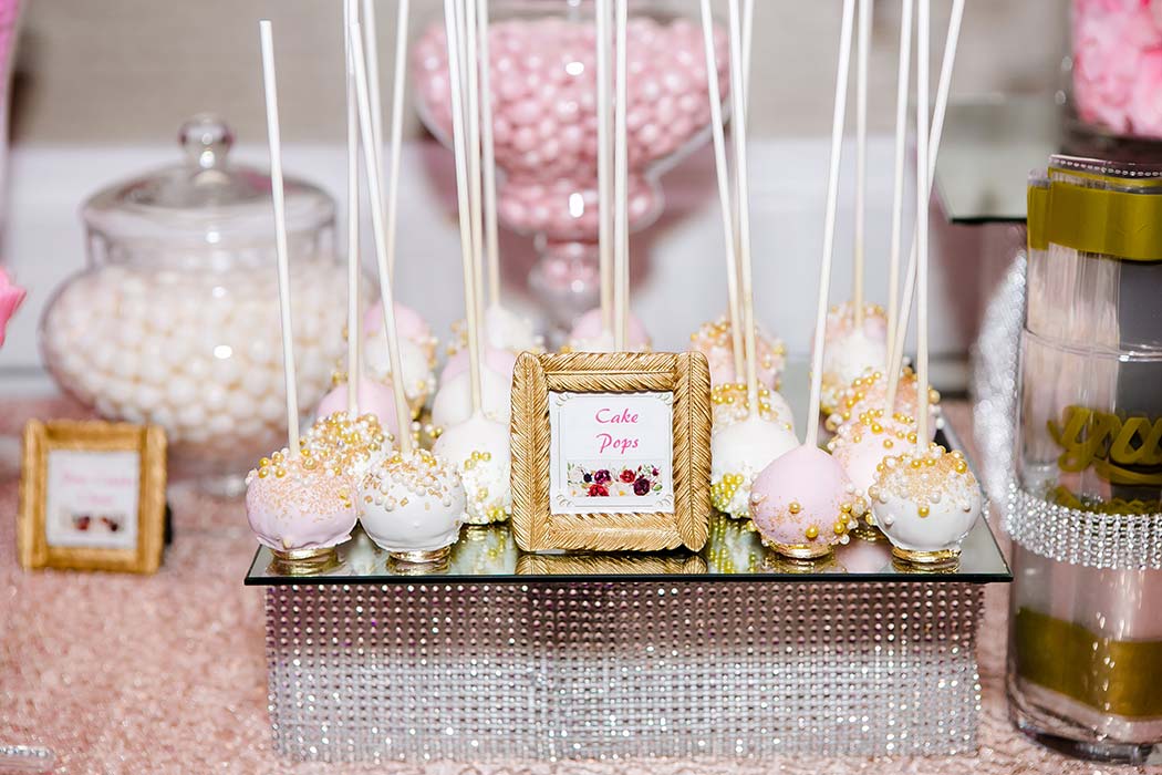 beautiful pink and white wedding candy table