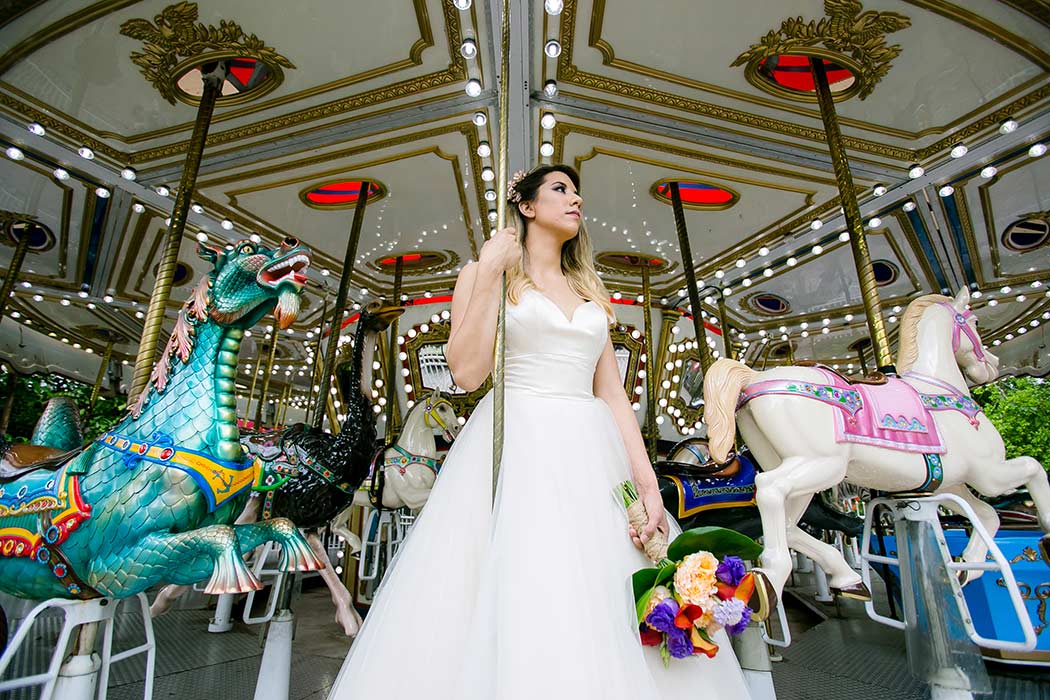 palm beach zoo modern wedding styled photoshoot | bride poses on fairground carousel | south florida wedding photographer