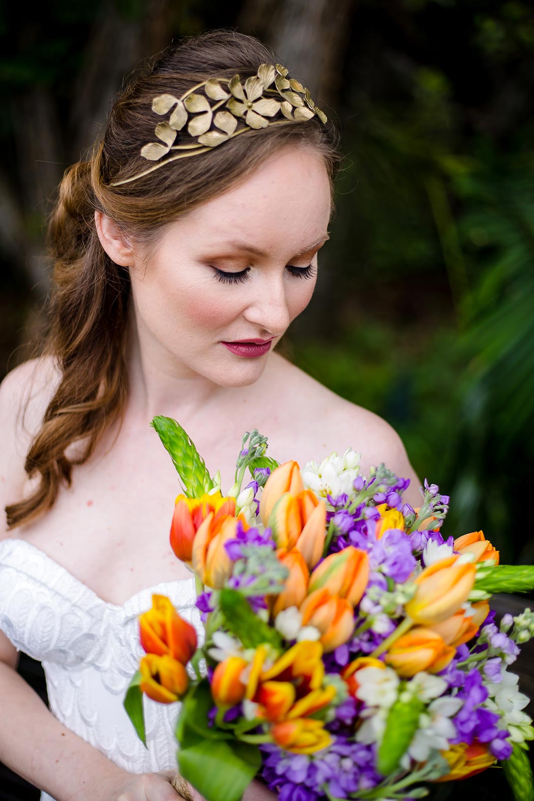 purple and orange wedding bouquet and metal wedding hair accessory for a wedding at palm beach zoo