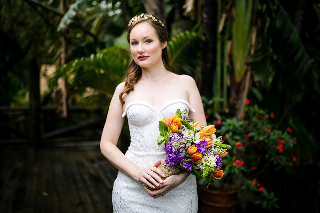 modern wedding styled photoshoot at palm beach zoo with purple and orange wedding bouquet