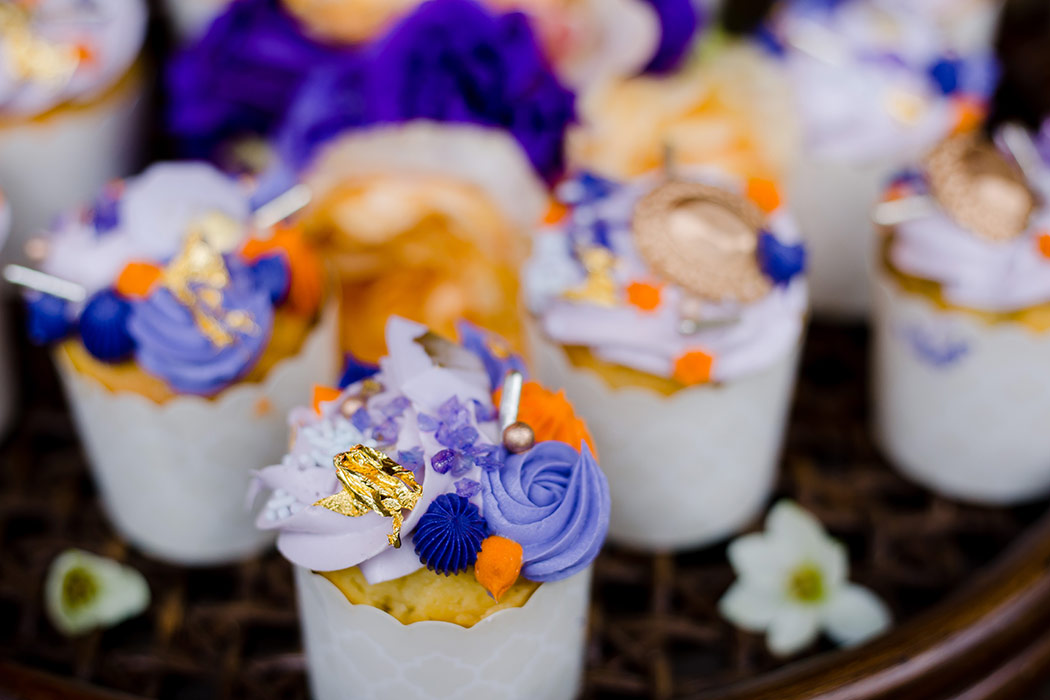 unique wedding cup cakes with purple, orange and gold detail | palm beach zoo wedding details