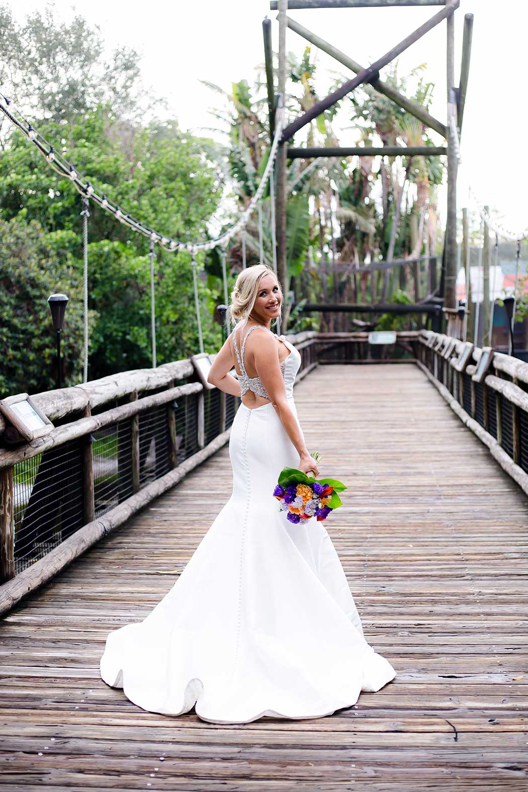 unique posing ideas for bride on wooden bridge | south florida wedding photographer