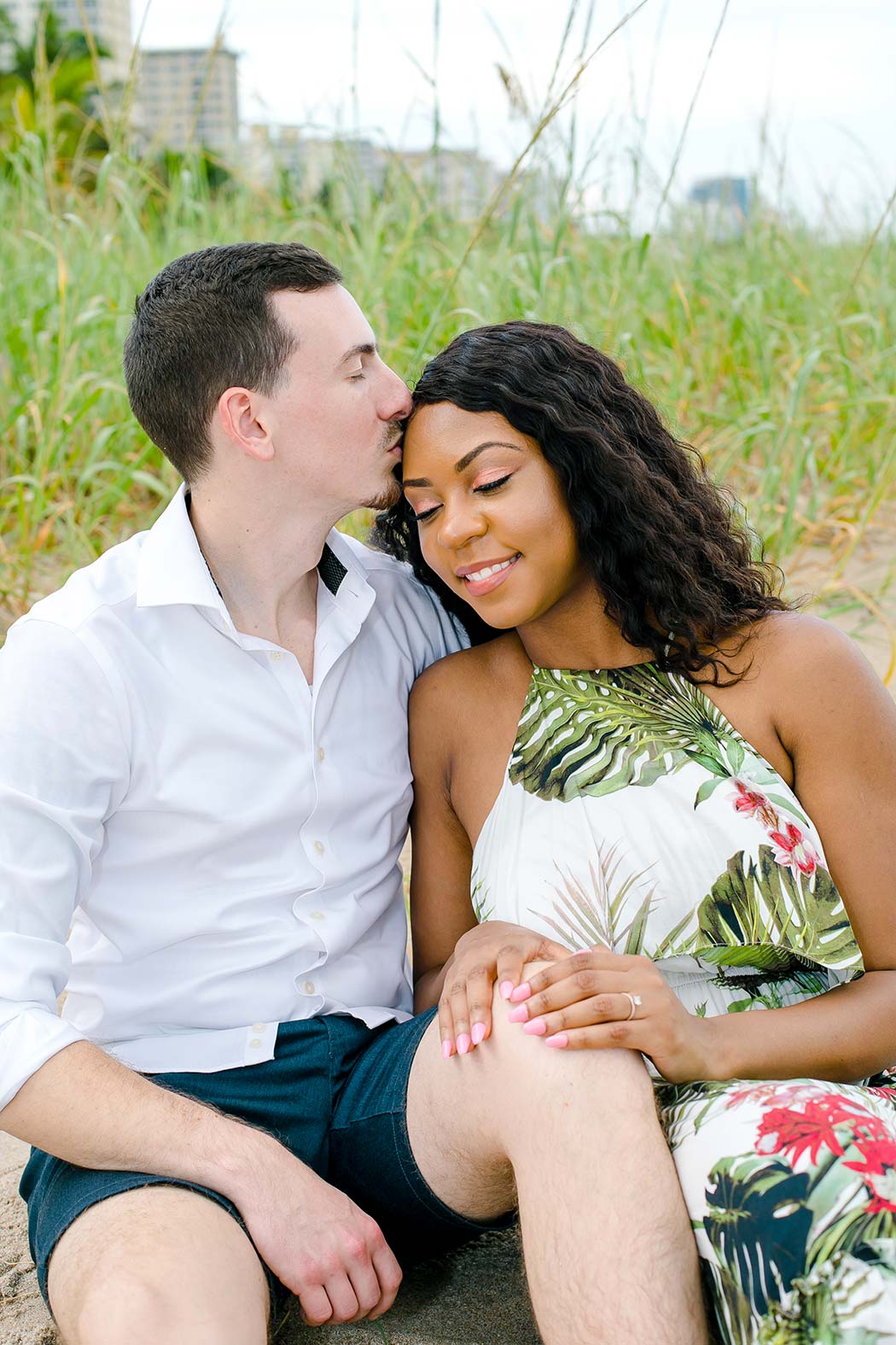 fort lauderdale engagement photographer | kissing photos for engagement session | beach engagement sitting poses