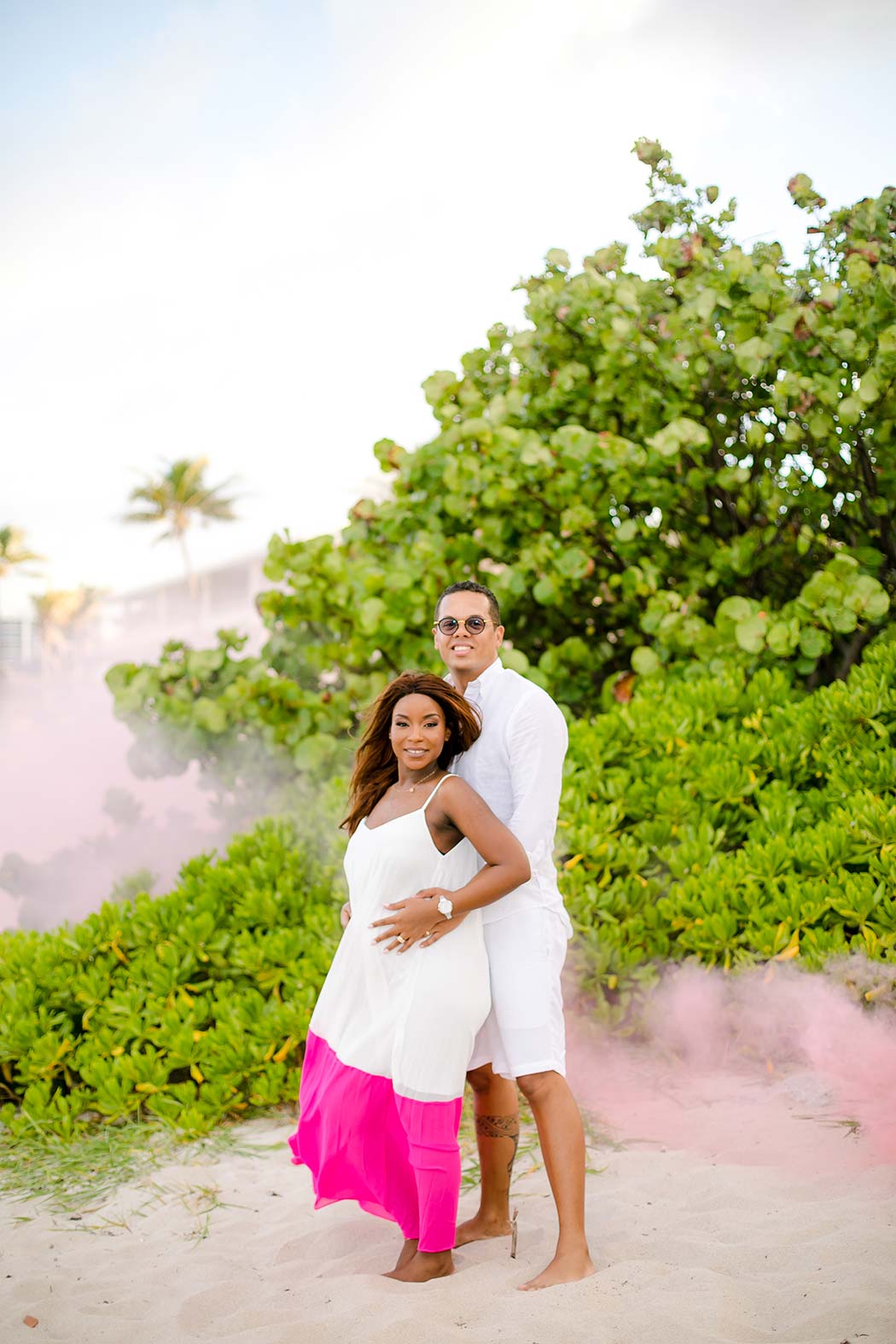 pink smoke bomb gender reveal on beach | fort lauderdale maternity photographer